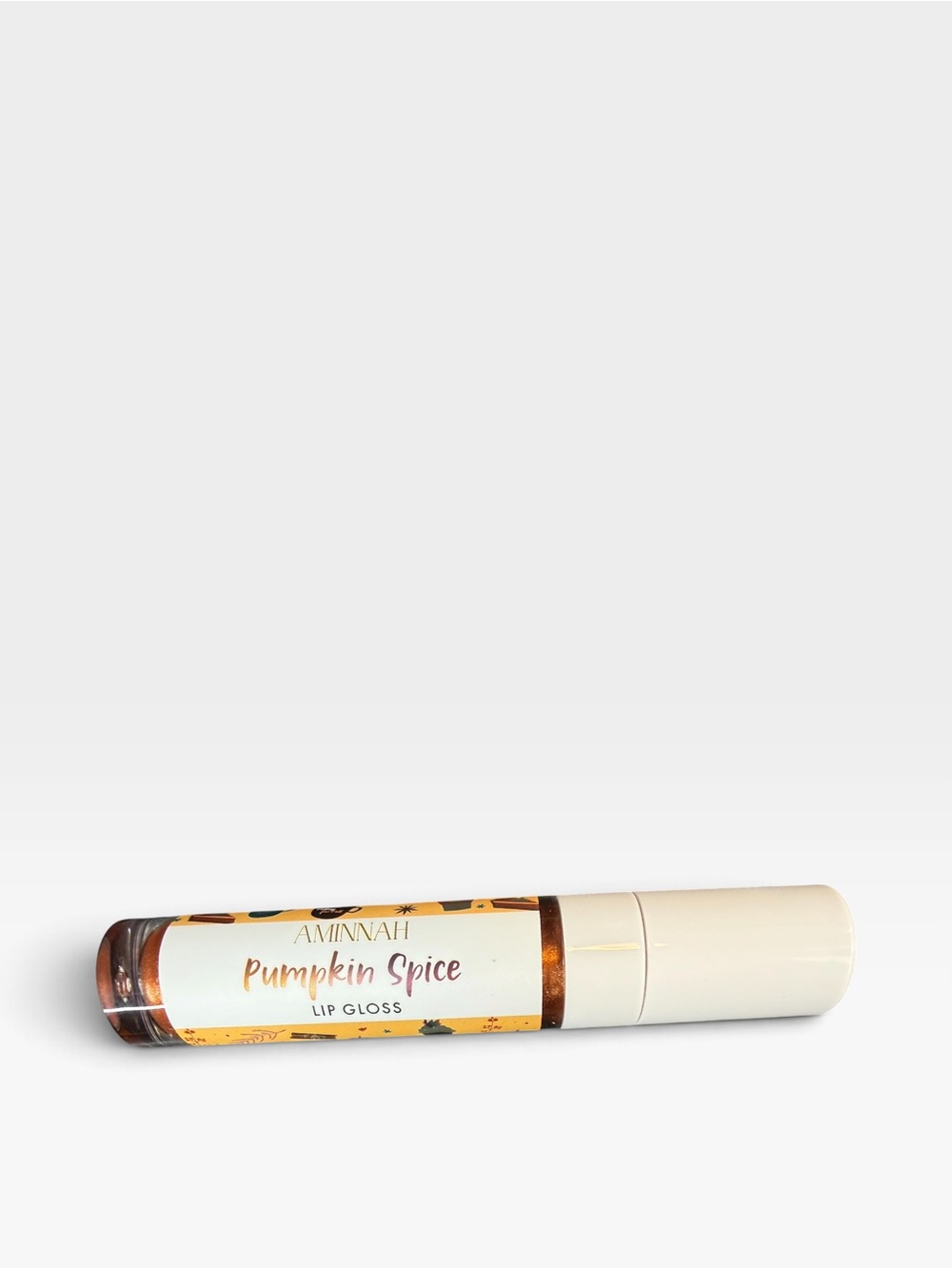 AMINNAH Pumpkin Spice Lip Gloss — Warm Copper Shine